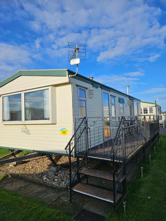 a tiny house sitting on a train track at Ingoldmells golden sands plot 152 in Ingoldmells