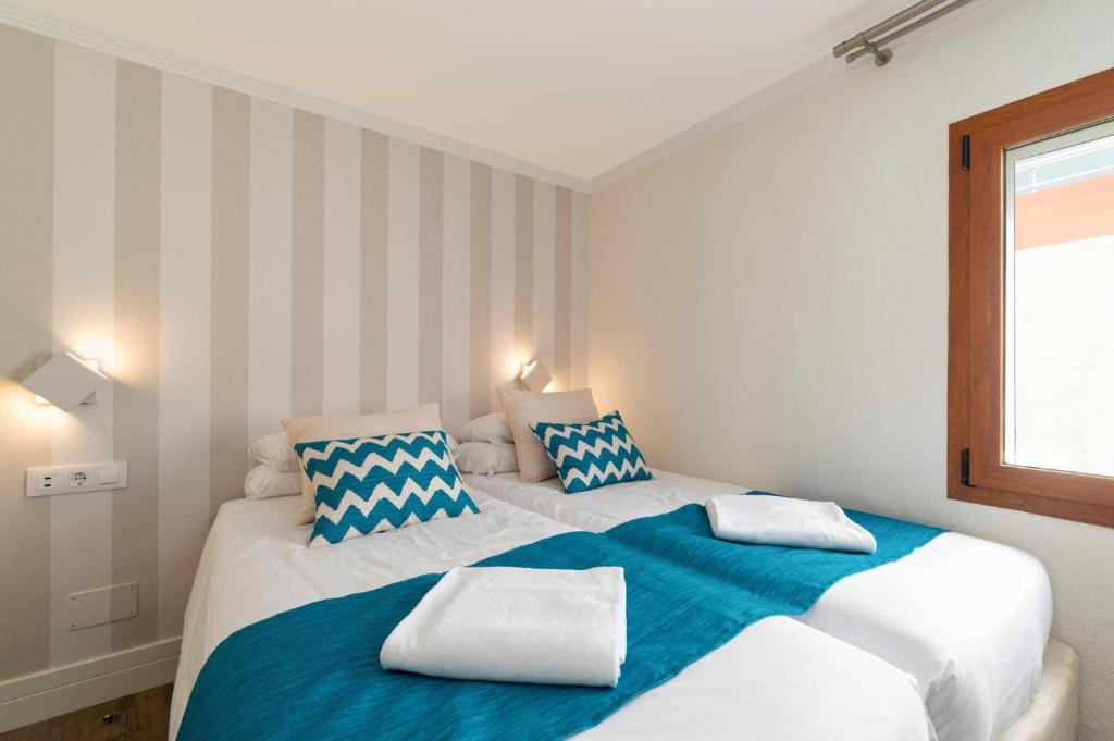Postel nebo postele na pokoji v ubytování Villa Lobos by Villa Plus