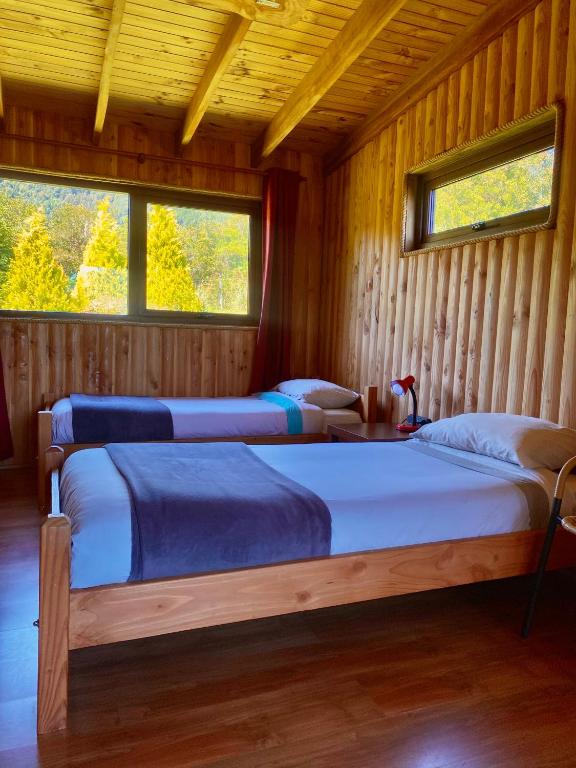 Postel nebo postele na pokoji v ubytování Las Bandurrias Eco Hostal