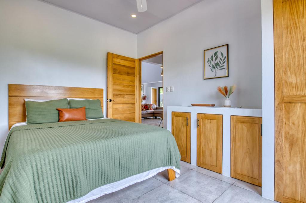 Postel nebo postele na pokoji v ubytování Hotel Villas Tangerine