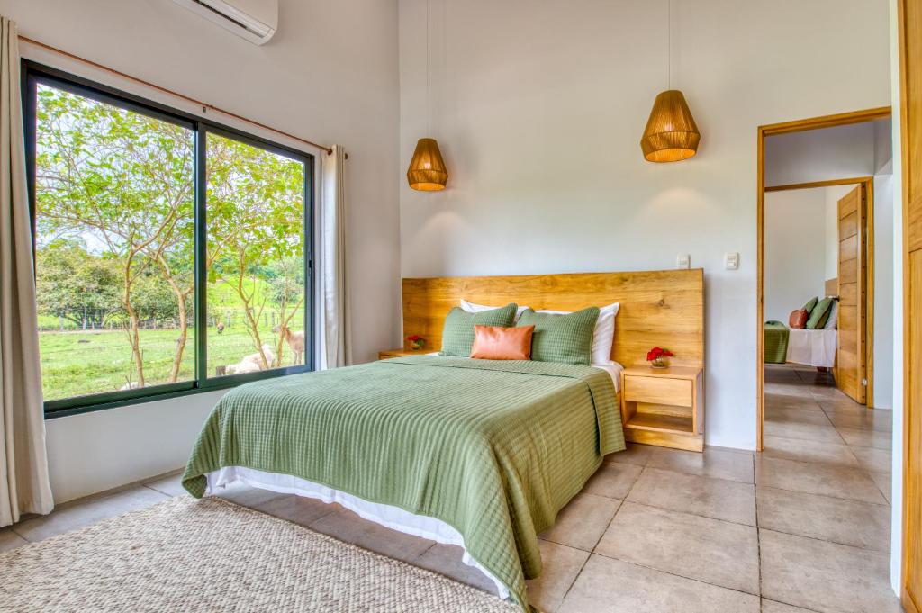 Postel nebo postele na pokoji v ubytování Hotel Villas Tangerine