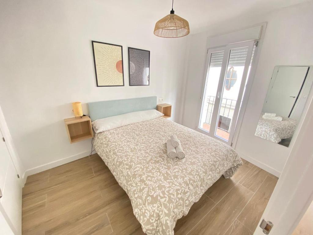 ロンダにあるApartamentos Rosarioのテディベアのベッドがある寝室
