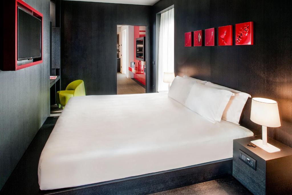 Postel nebo postele na pokoji v ubytování Glam Milano