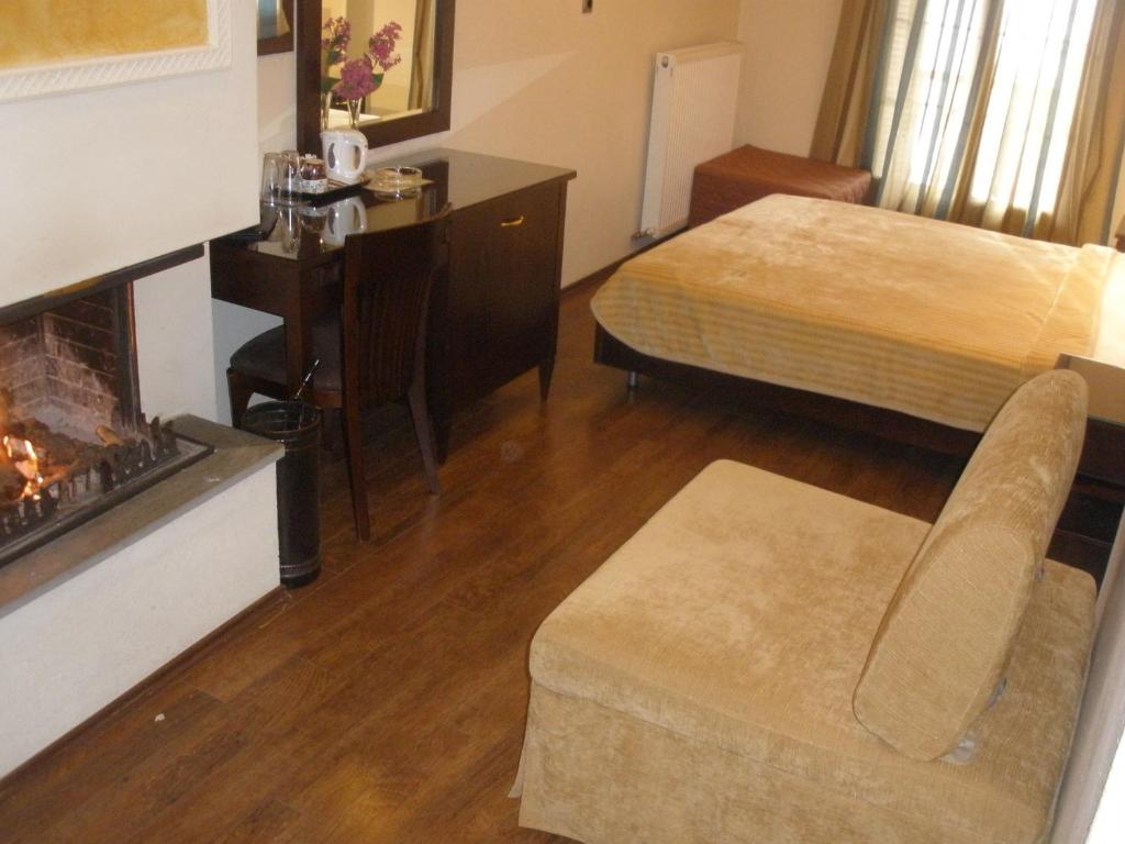 Postel nebo postele na pokoji v ubytování Pelias Hotel