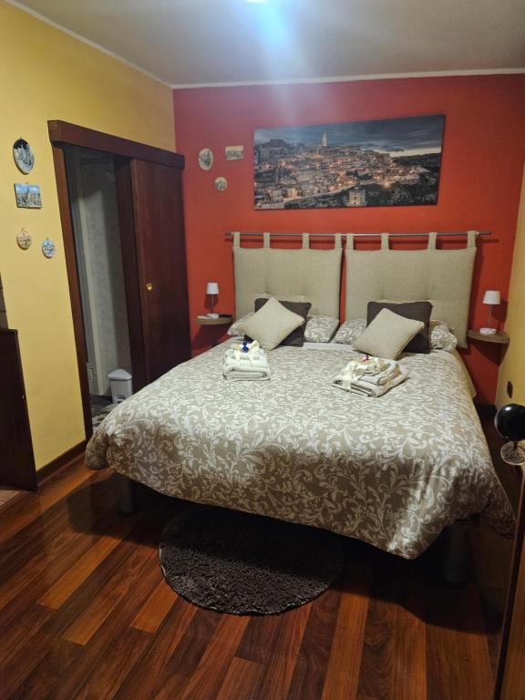 Postel nebo postele na pokoji v ubytování Sassi's Loft