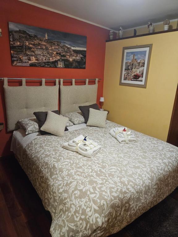 Postel nebo postele na pokoji v ubytování Sassi's Loft