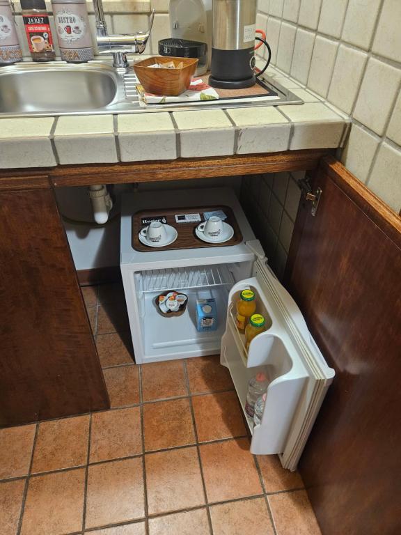Kuchyň nebo kuchyňský kout v ubytování Sassi's Loft
