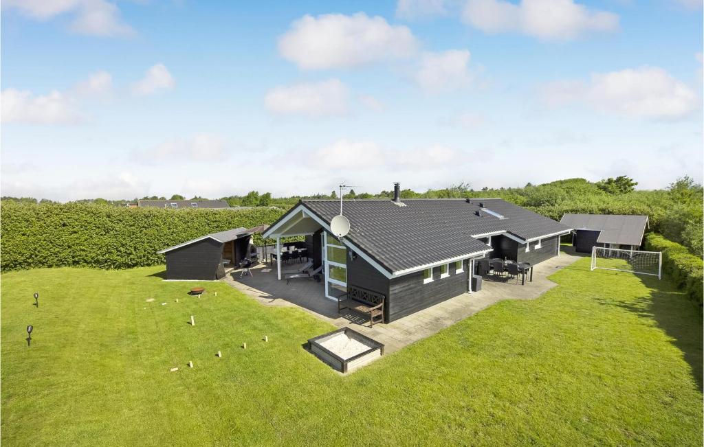 an aerial view of a house with a large yard at Holiday Home Tarm 49 in Hemmet