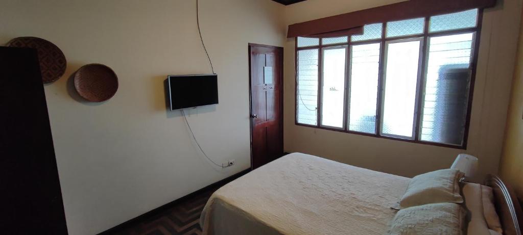 Postel nebo postele na pokoji v ubytování Flying Dog Hostel Iquitos