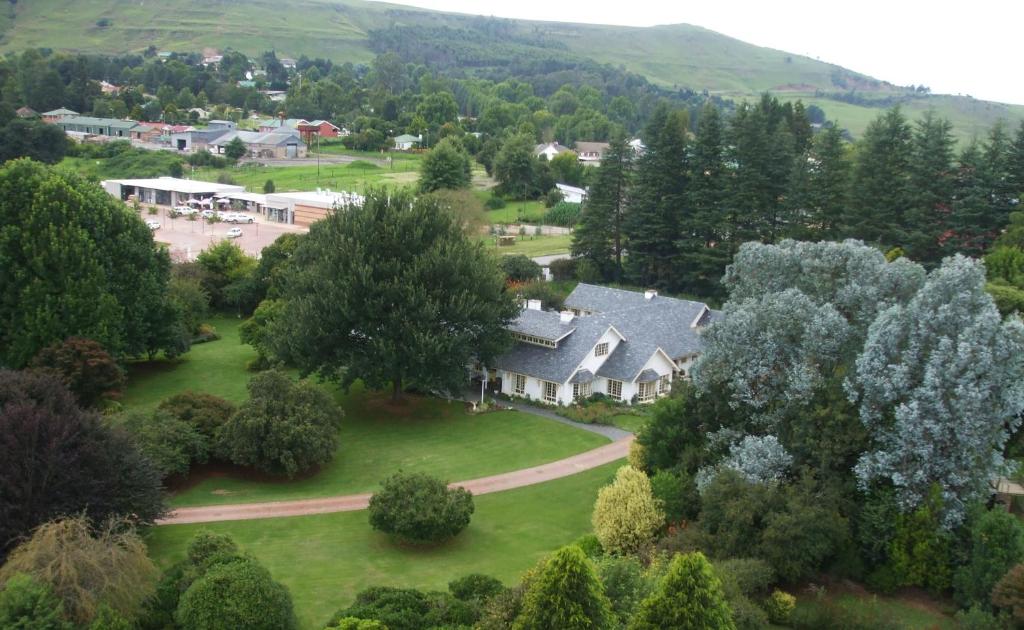 an aerial view of a house in a village at Cedar Garden in Underberg