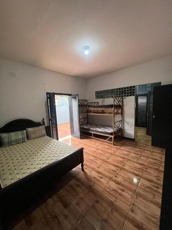 Ένα ή περισσότερα κρεβάτια σε δωμάτιο στο Quarto Duplo Praia dos Sonhos