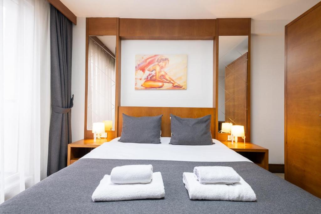 a bedroom with a bed with two towels on it at Dreams İstanbul Hotel in Istanbul