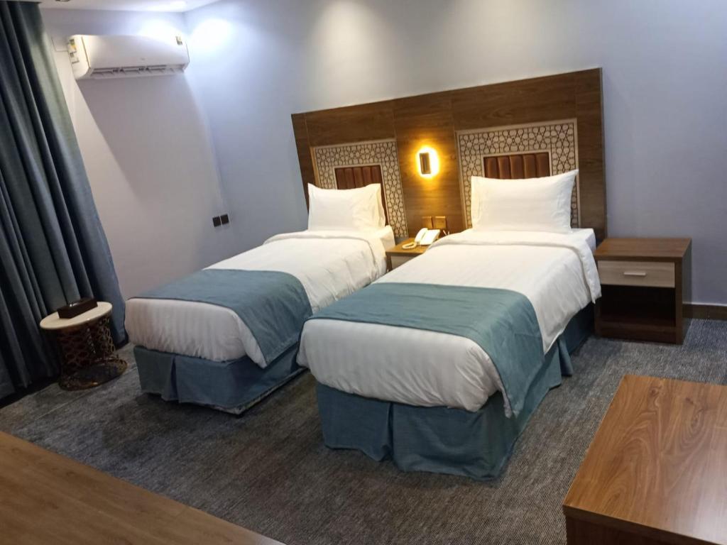 Postel nebo postele na pokoji v ubytování فندق ملاذ Malath Hotel