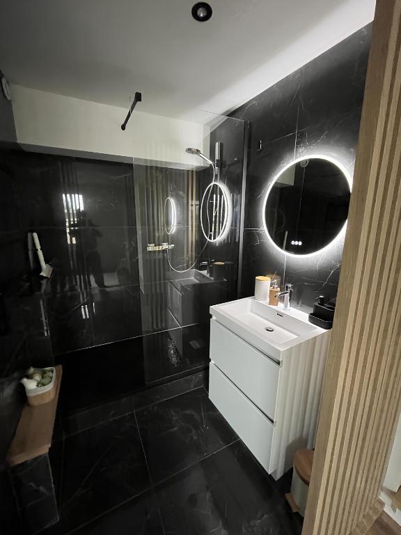 Koupelna v ubytování Le Duplex de la côte