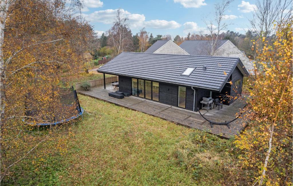 an overhead view of a black house with a deck at 3 Bedroom Nice Home In Fårevejle in Fårevejle