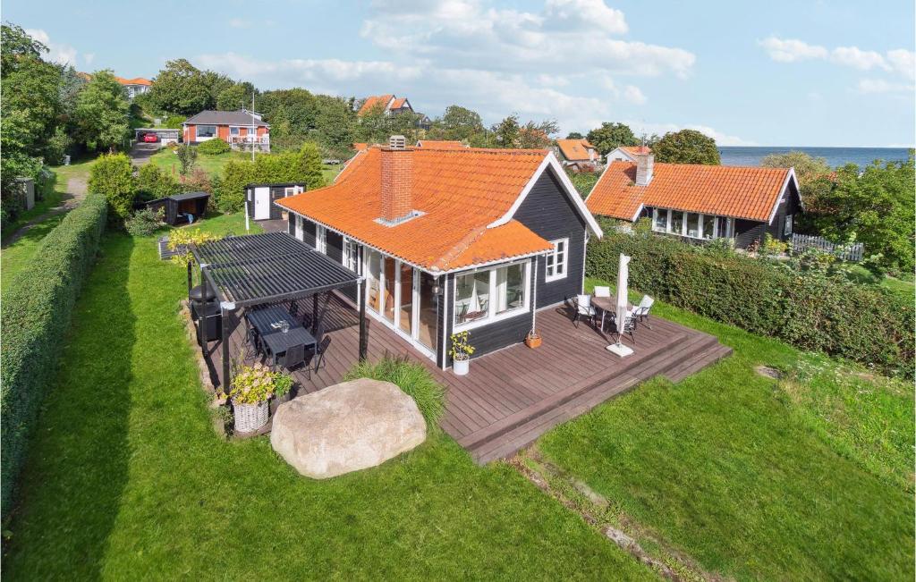 an aerial view of a house with a deck at Nice Home In Gudhjem With Kitchen in Gudhjem