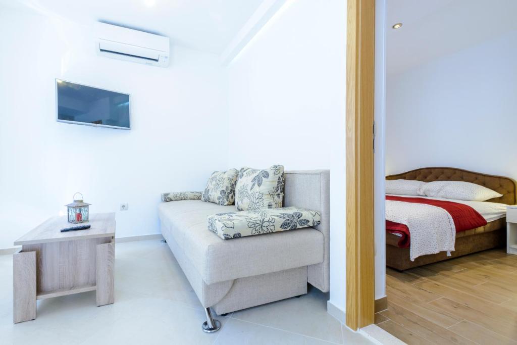 Posteľ alebo postele v izbe v ubytovaní Imperium Apartments