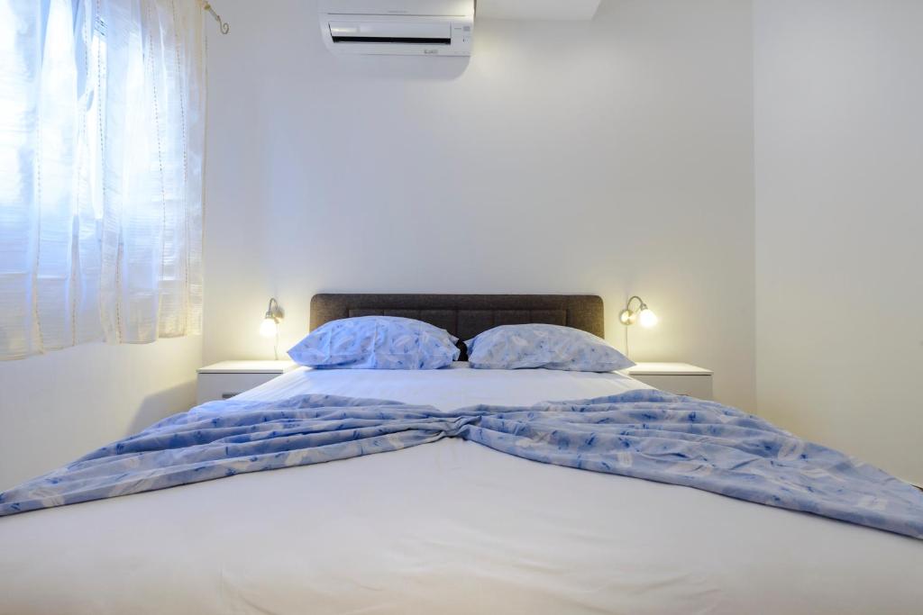 Posteľ alebo postele v izbe v ubytovaní Imperium Apartments