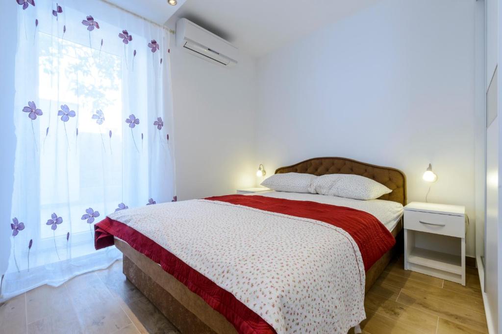 Posteľ alebo postele v izbe v ubytovaní Imperium Apartments