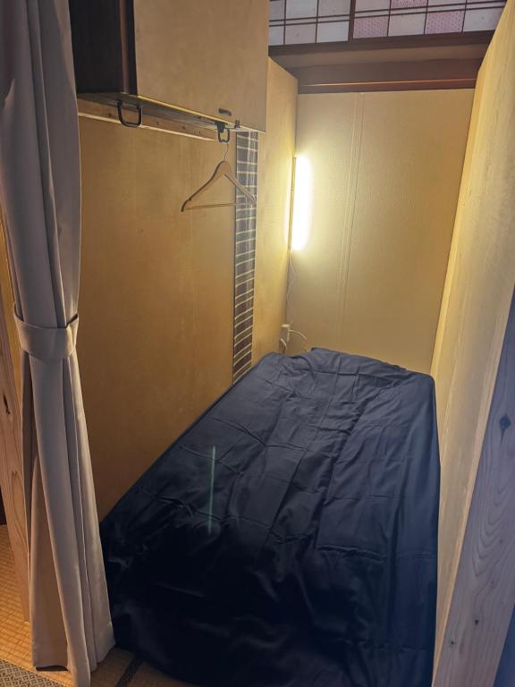 Postel nebo postele na pokoji v ubytování Retreat Narita