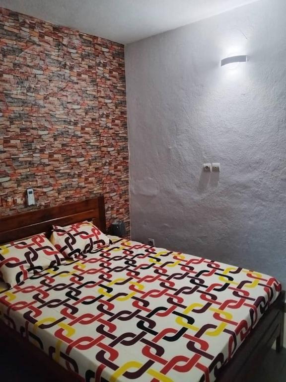 Ένα ή περισσότερα κρεβάτια σε δωμάτιο στο Résidence Daniel