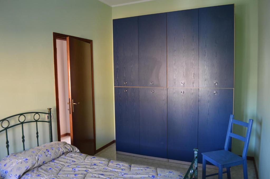 Łóżko lub łóżka w pokoju w obiekcie L'Orchidea di Ale
