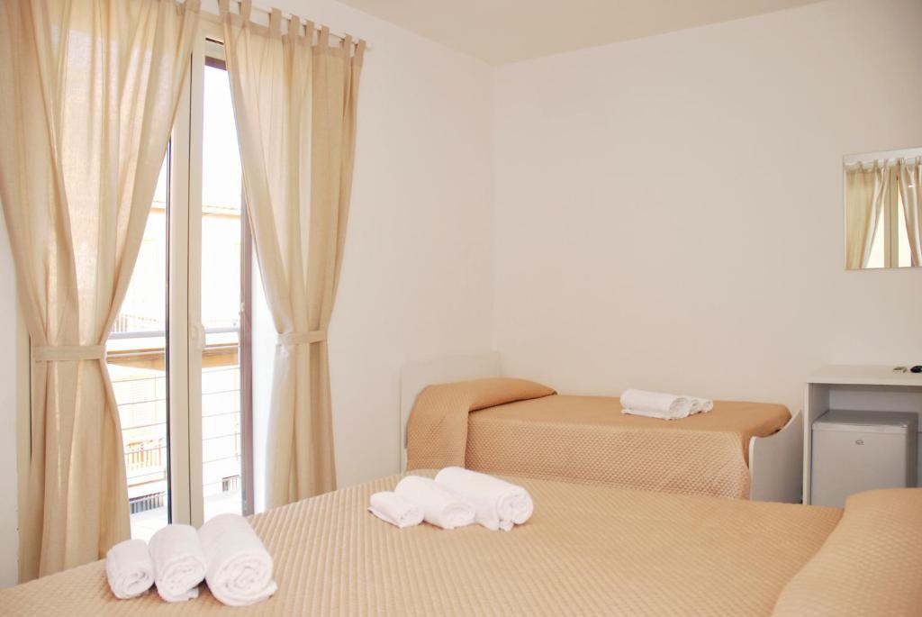 Postel nebo postele na pokoji v ubytování B&B Sikelia
