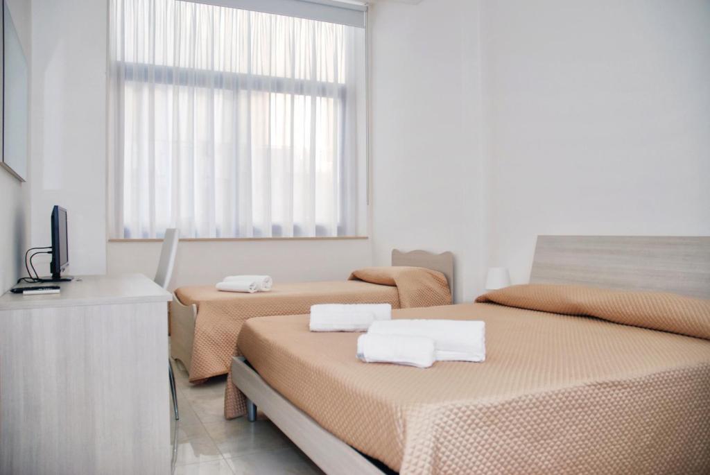 Postel nebo postele na pokoji v ubytování B&B Sikelia