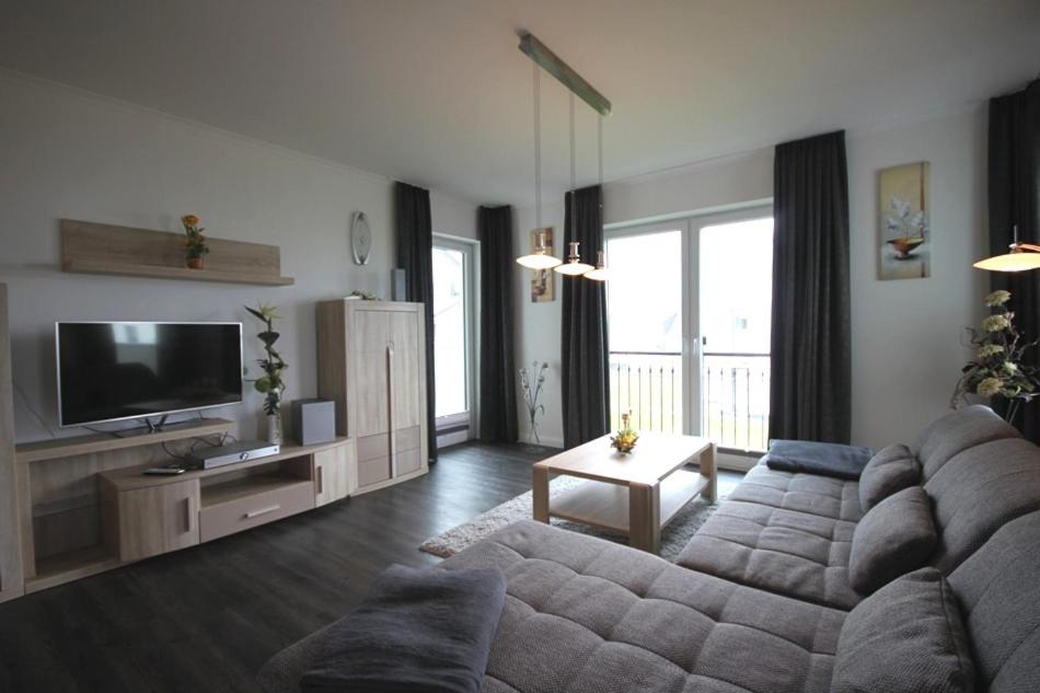 TV a/nebo společenská místnost v ubytování Residenz Am Meer