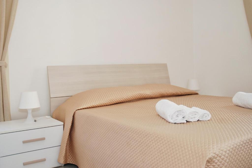 Postel nebo postele na pokoji v ubytování B&B Sikelia