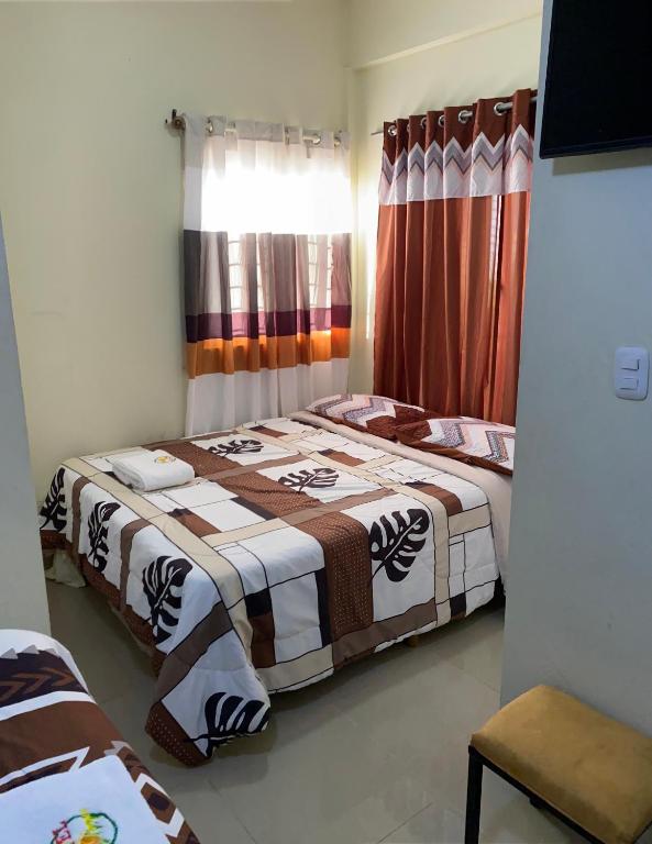 Postel nebo postele na pokoji v ubytování Hotel El Parque Constanza