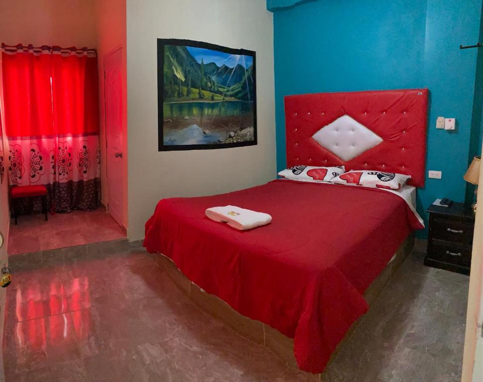 Postel nebo postele na pokoji v ubytování Hotel El Parque Constanza