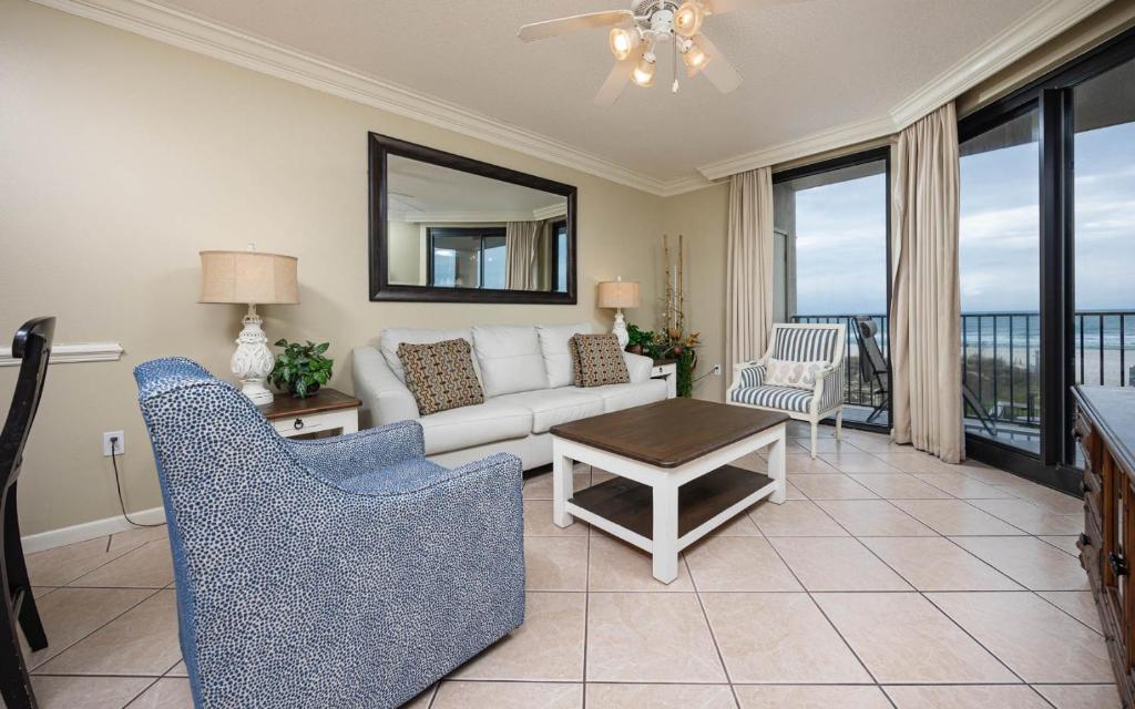 a living room with a couch and a table at Phoenix X 211 condo in Orange Beach