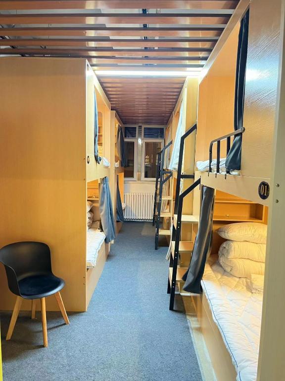 Postel nebo postele na pokoji v ubytování Zhihexing Youth Hostel-知和行青年酒店