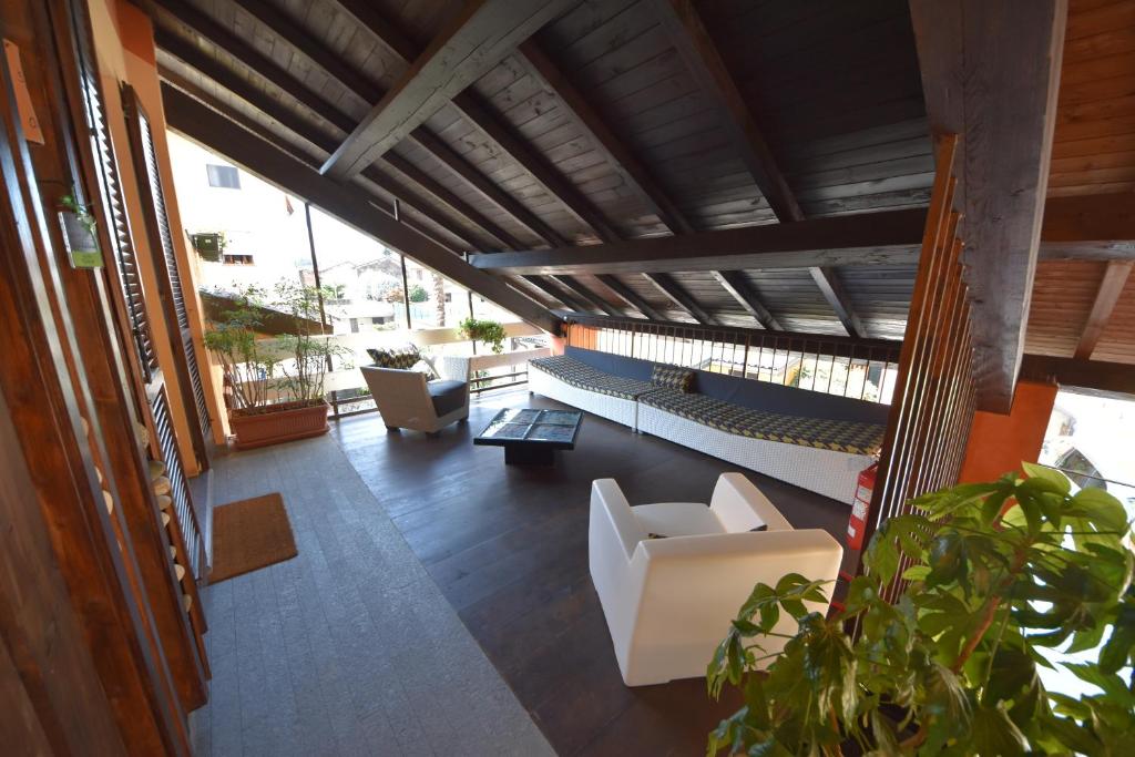 a view of a living room with white furniture at Suite Manzoni in Boffalora sopra Ticino