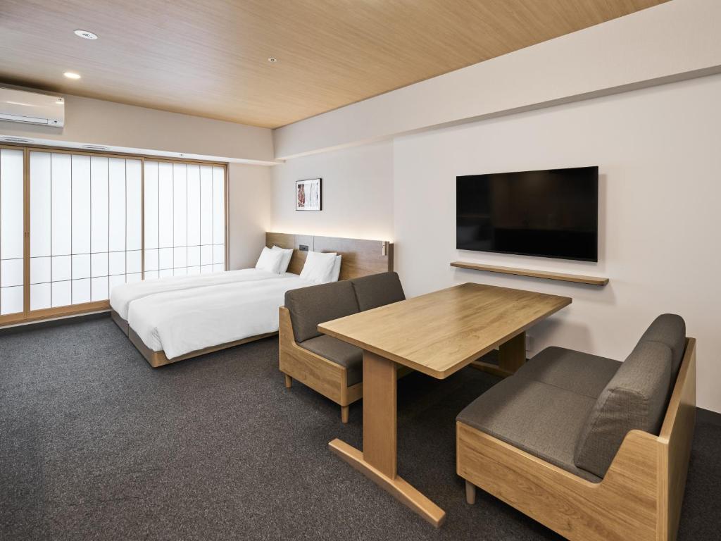Postel nebo postele na pokoji v ubytování MIMARU Tokyo Kinshicho