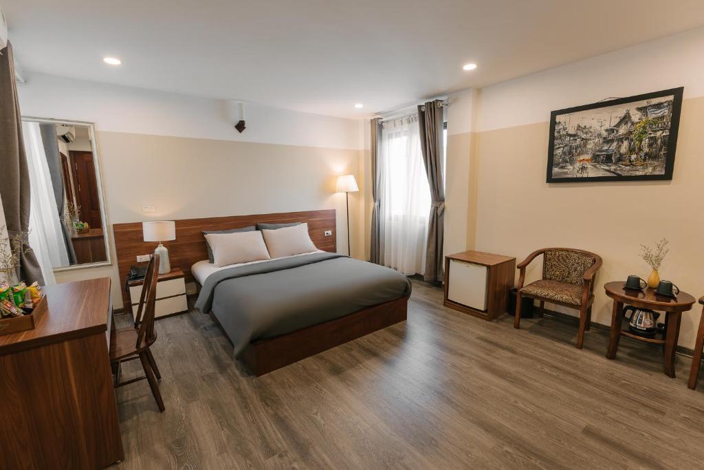 Postel nebo postele na pokoji v ubytování An Nguyen Boutique Hotel