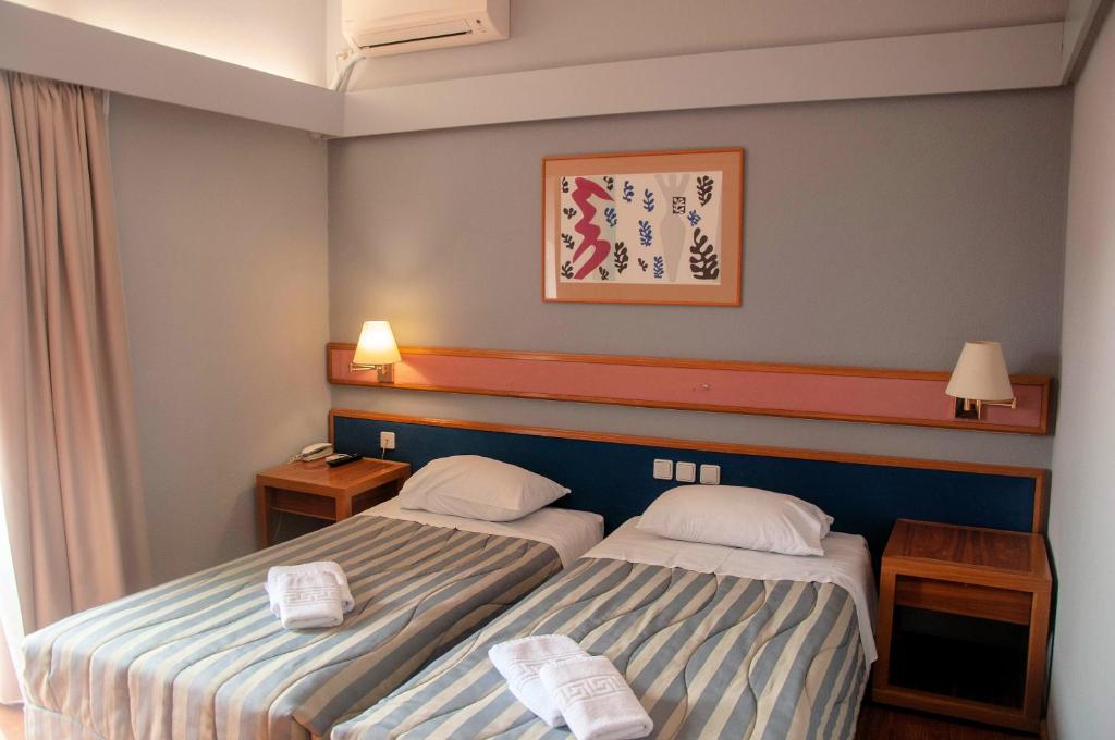 Postel nebo postele na pokoji v ubytování Hotel Samaras