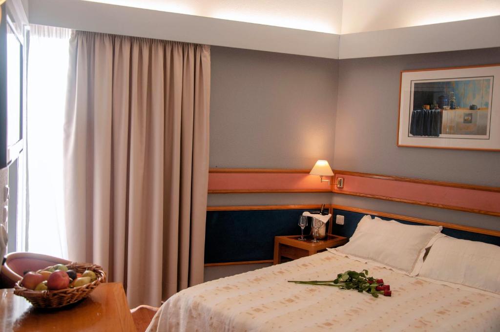 Postel nebo postele na pokoji v ubytování Hotel Samaras