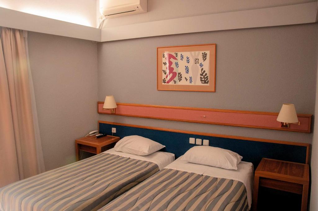 Postel nebo postele na pokoji v ubytování Hotel Samaras