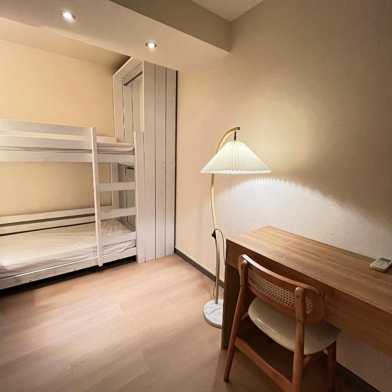 Postel nebo postele na pokoji v ubytování Cat Tail Pocket Inn