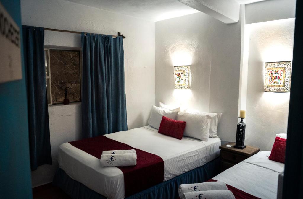 Letto o letti in una camera di Hostal Doña Emma