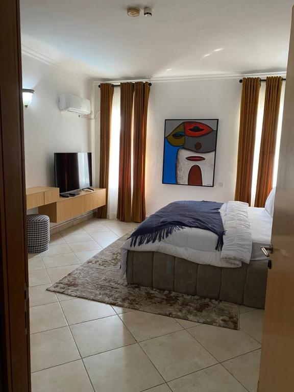 Postel nebo postele na pokoji v ubytování Enzo Apartments