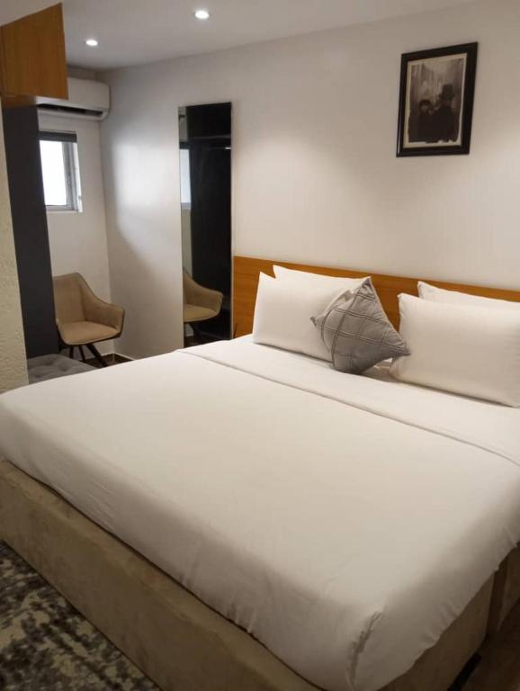 Postel nebo postele na pokoji v ubytování Enzo Apartments