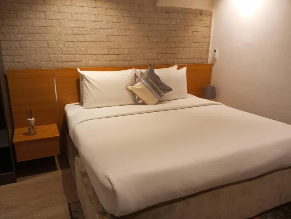 Postel nebo postele na pokoji v ubytování Enzo Apartments