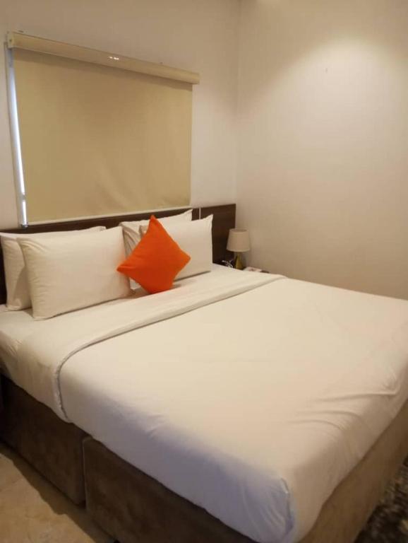 Postel nebo postele na pokoji v ubytování Enzo Apartments