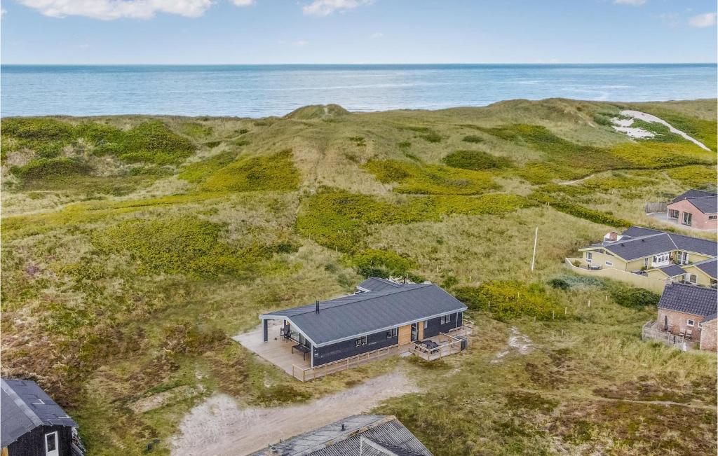 an aerial view of a house on the beach at Holiday Home Hvide Sande 25 in Bjerregård