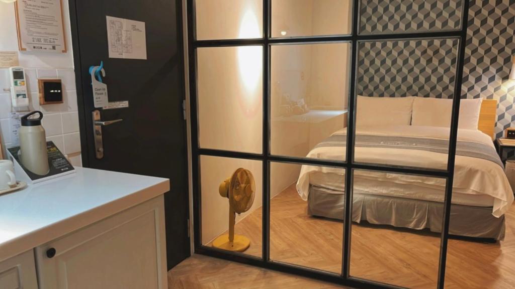 Postel nebo postele na pokoji v ubytování Chill Roof Hotel