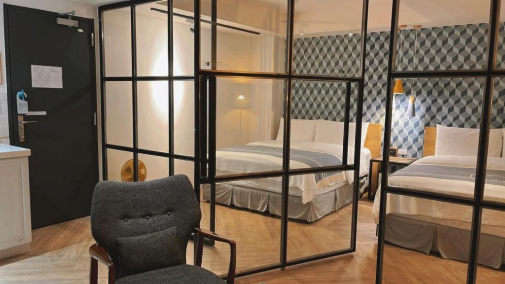 Postel nebo postele na pokoji v ubytování Chill Roof Hotel