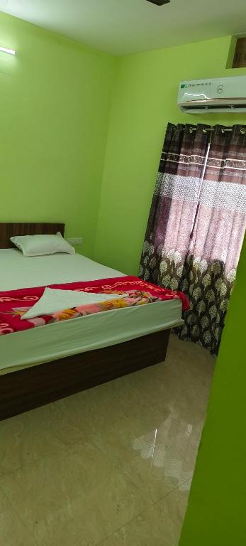 Postel nebo postele na pokoji v ubytování Hotel Siddhi
